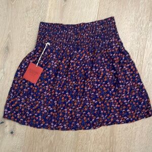 Cute brand NWT skirt with elasticized waist, never worn